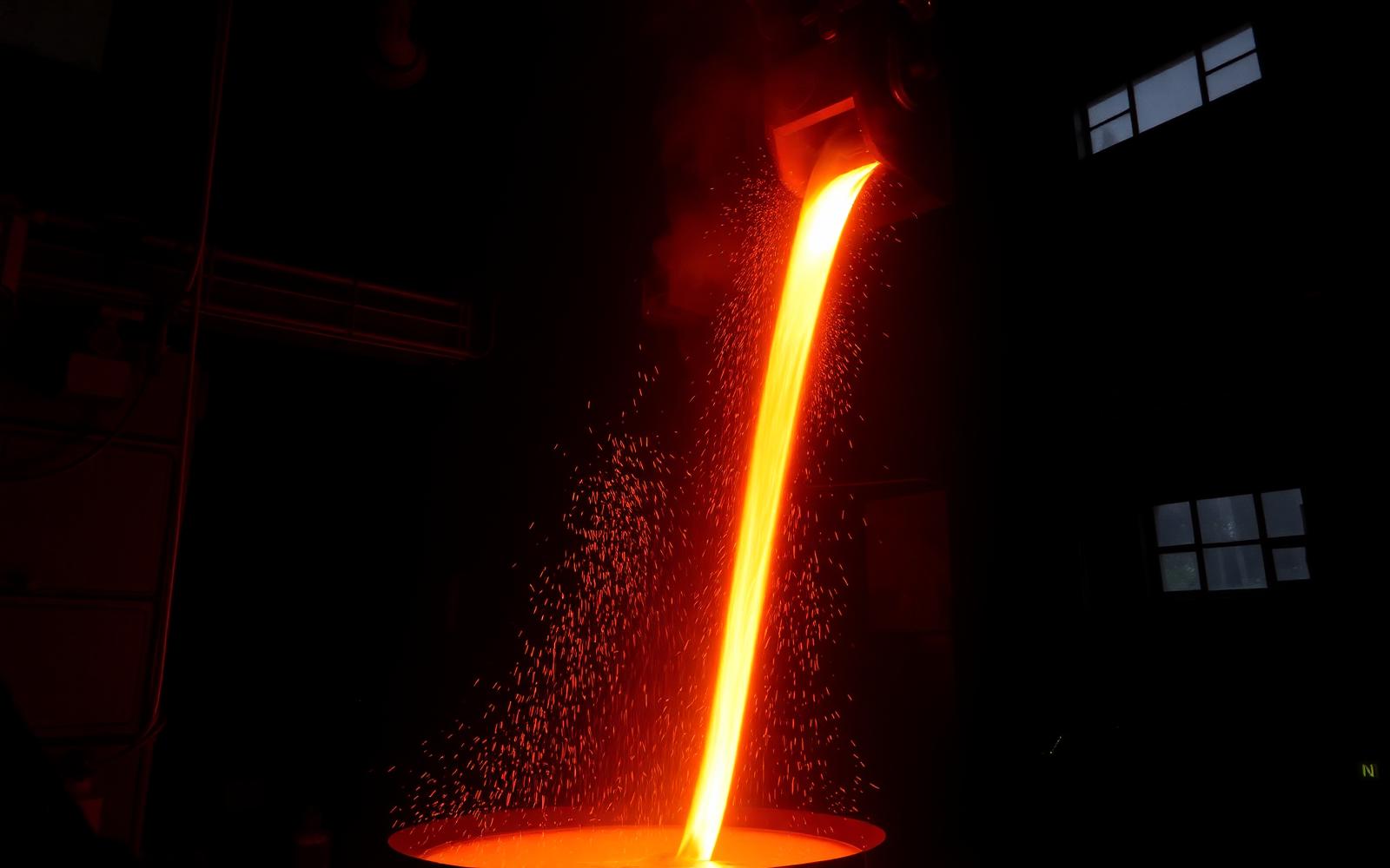 Molten aluminium being poured inside a foundry